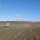 KRM Bredal fertilsing Oil Seed Rape  -  spreading granular urea. Our own trays laid out testing and checking the spread pattern.