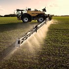 Challenger RoGator spraying, using Defy nozzles forward and back