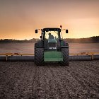 Brett rolling drilled wheat ground with John Deere 7530